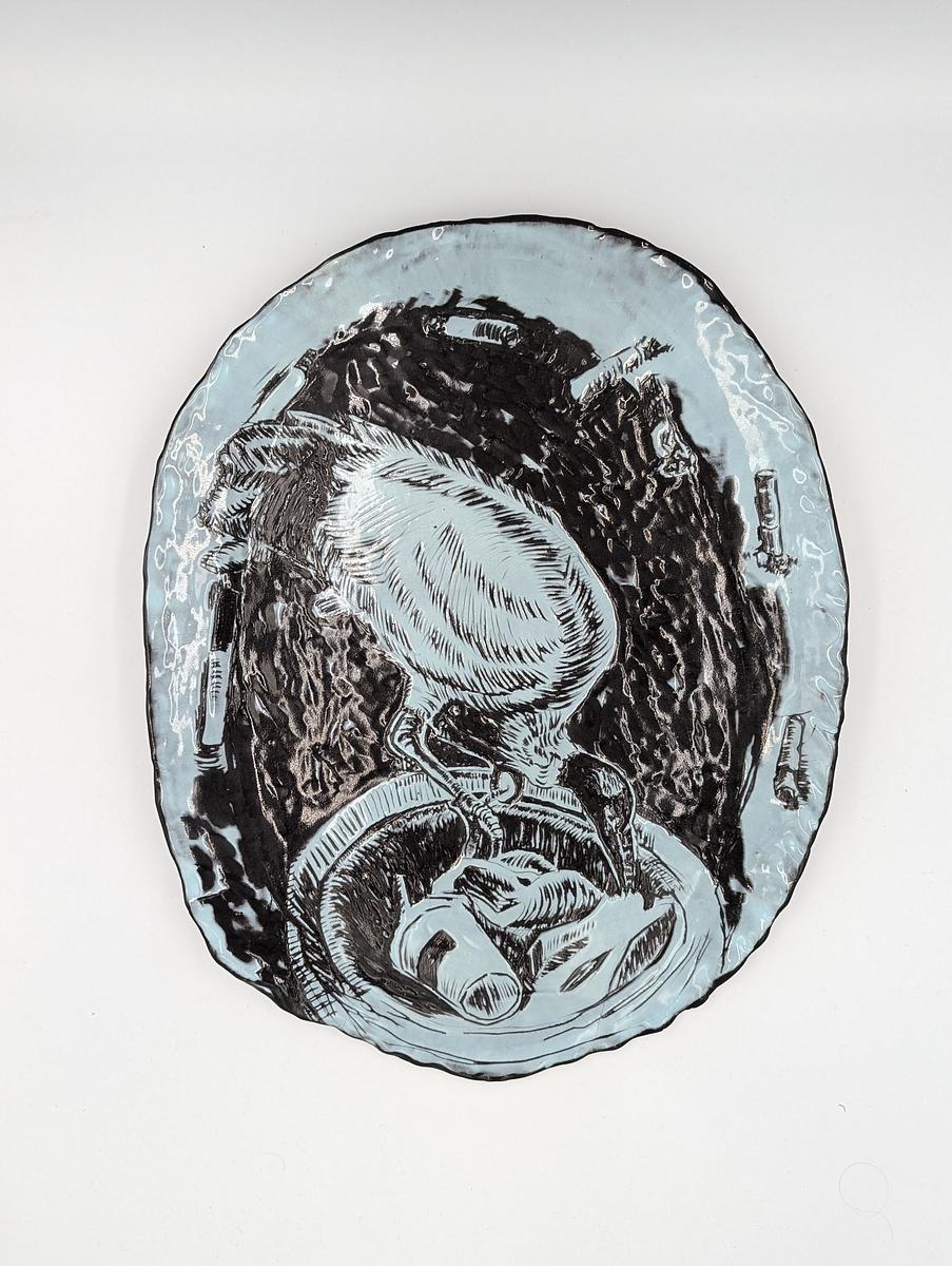 Coloured blue slip on black clay with Sgraffito.