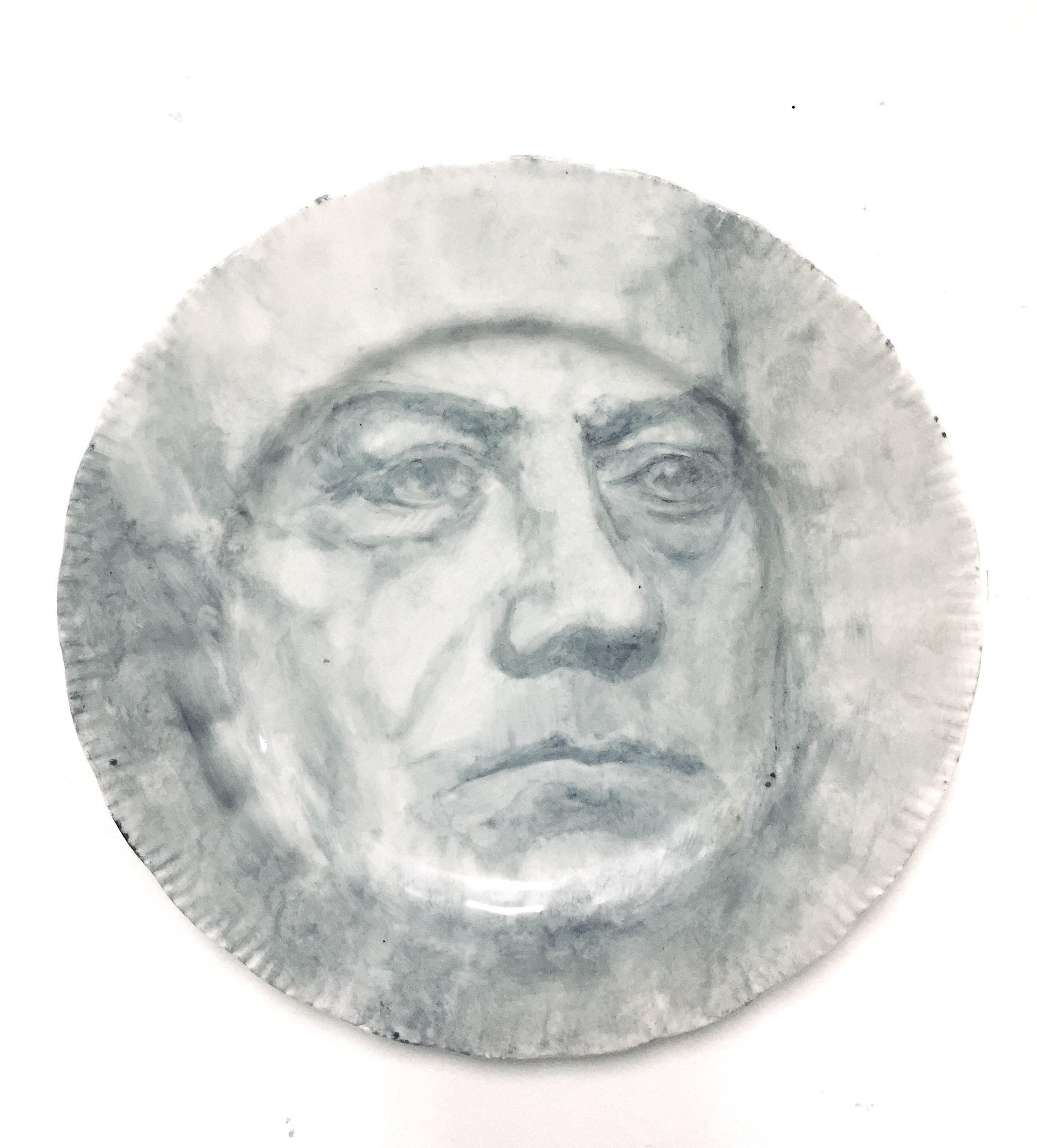 Onglaze portrait painting on a second hand ceramic plate based on a family photograph.