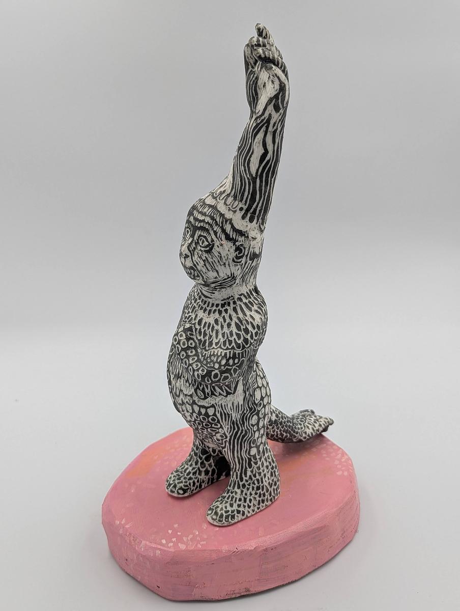 Slip cast sculpture Sgraffito on coloured slip on pink wood base with acrylic paint 