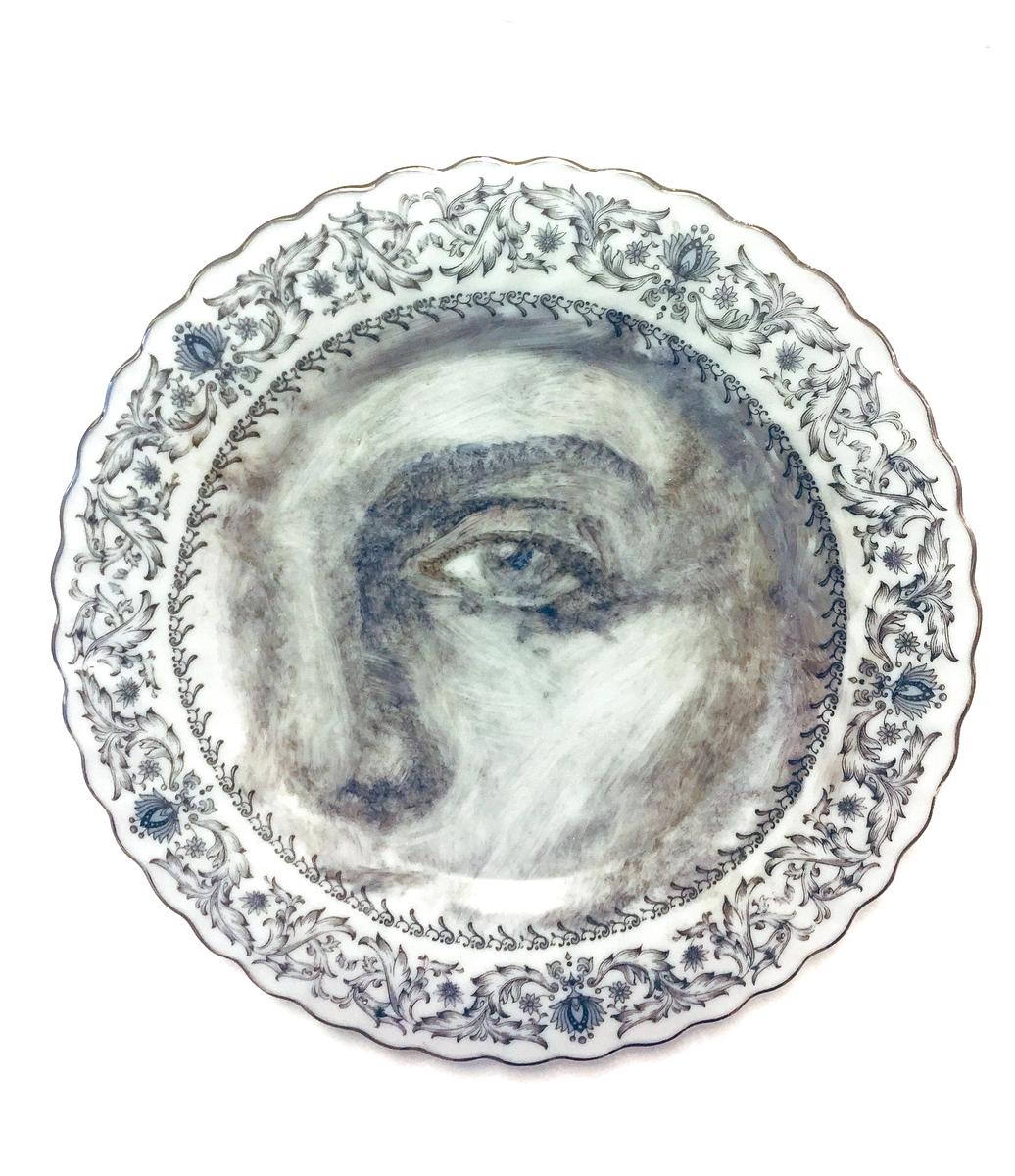 Onglaze portrait painting on a second hand ceramic plate based on a family photograph.