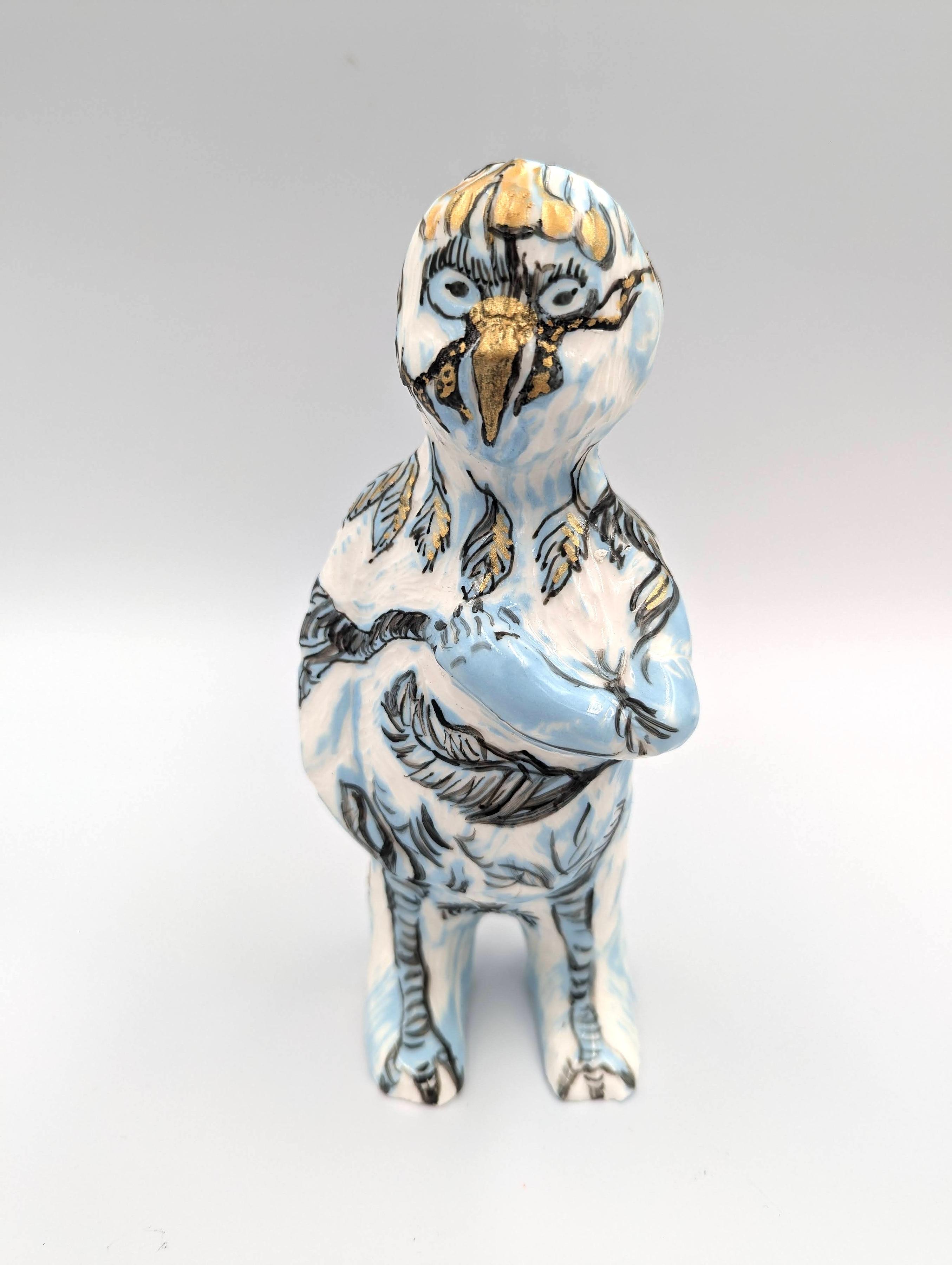 slip cast porcelain clay with coloured slip with sgraffito and gold porcelain pen.