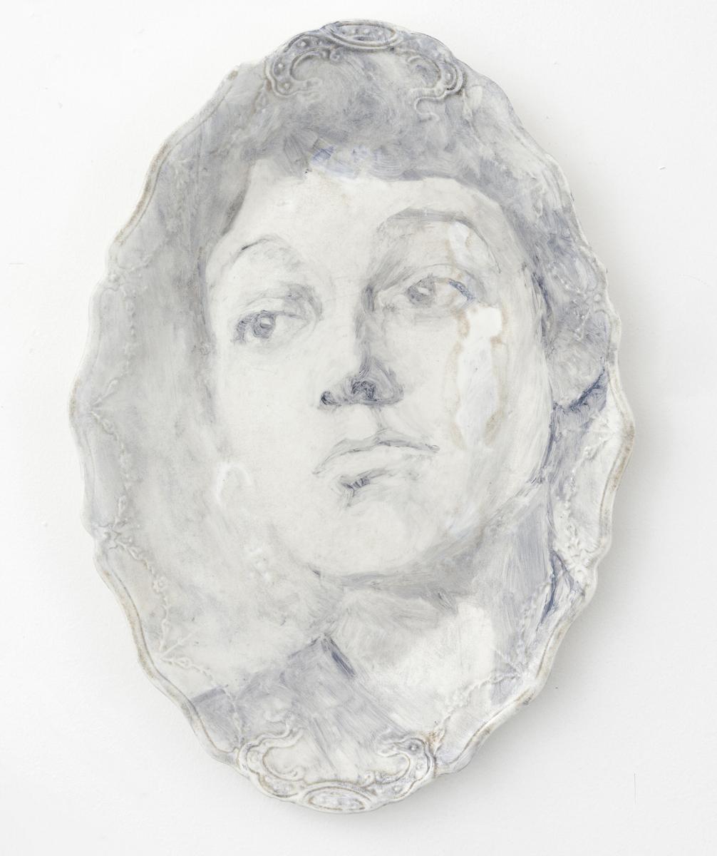 Onglaze portrait painting on a second hand ceramic plate based on a family photograph.