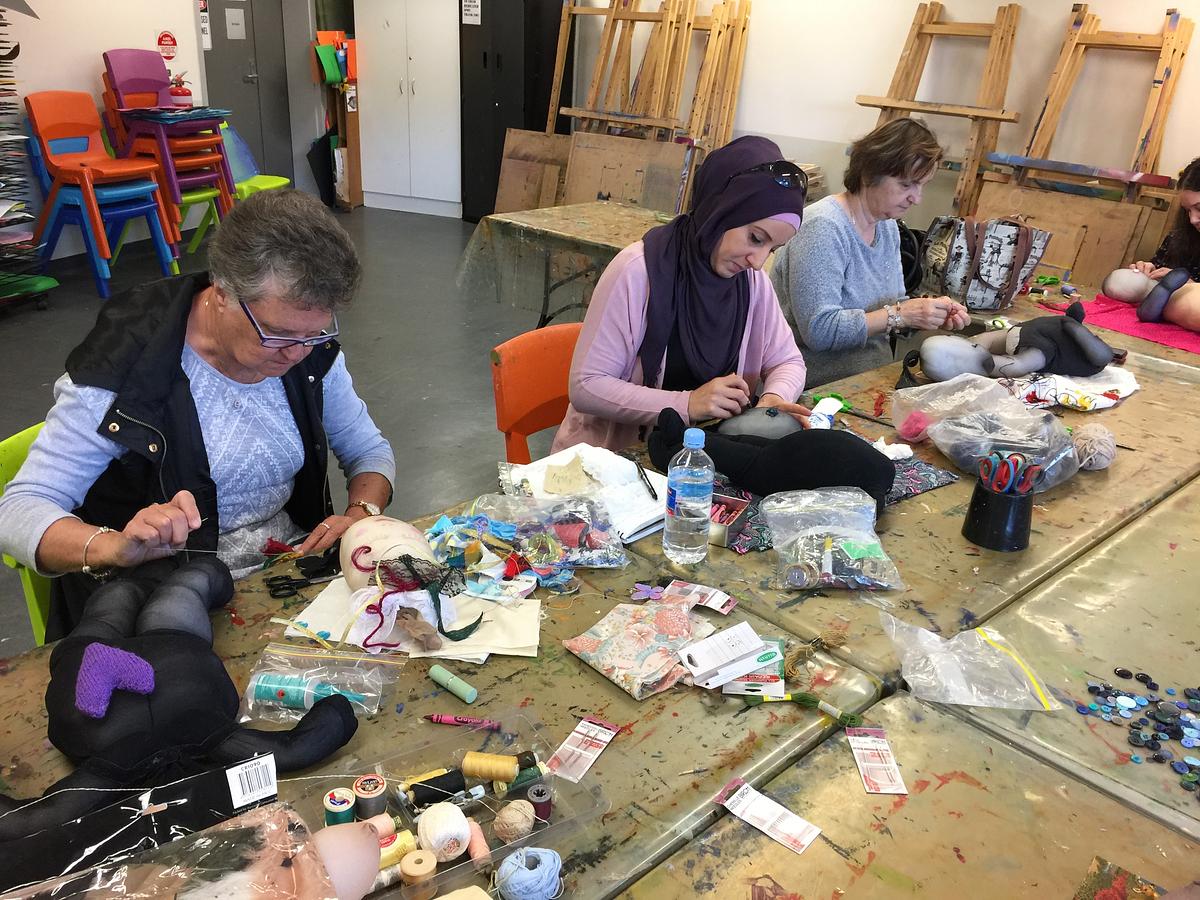 details of craft group working on soft sculptures.